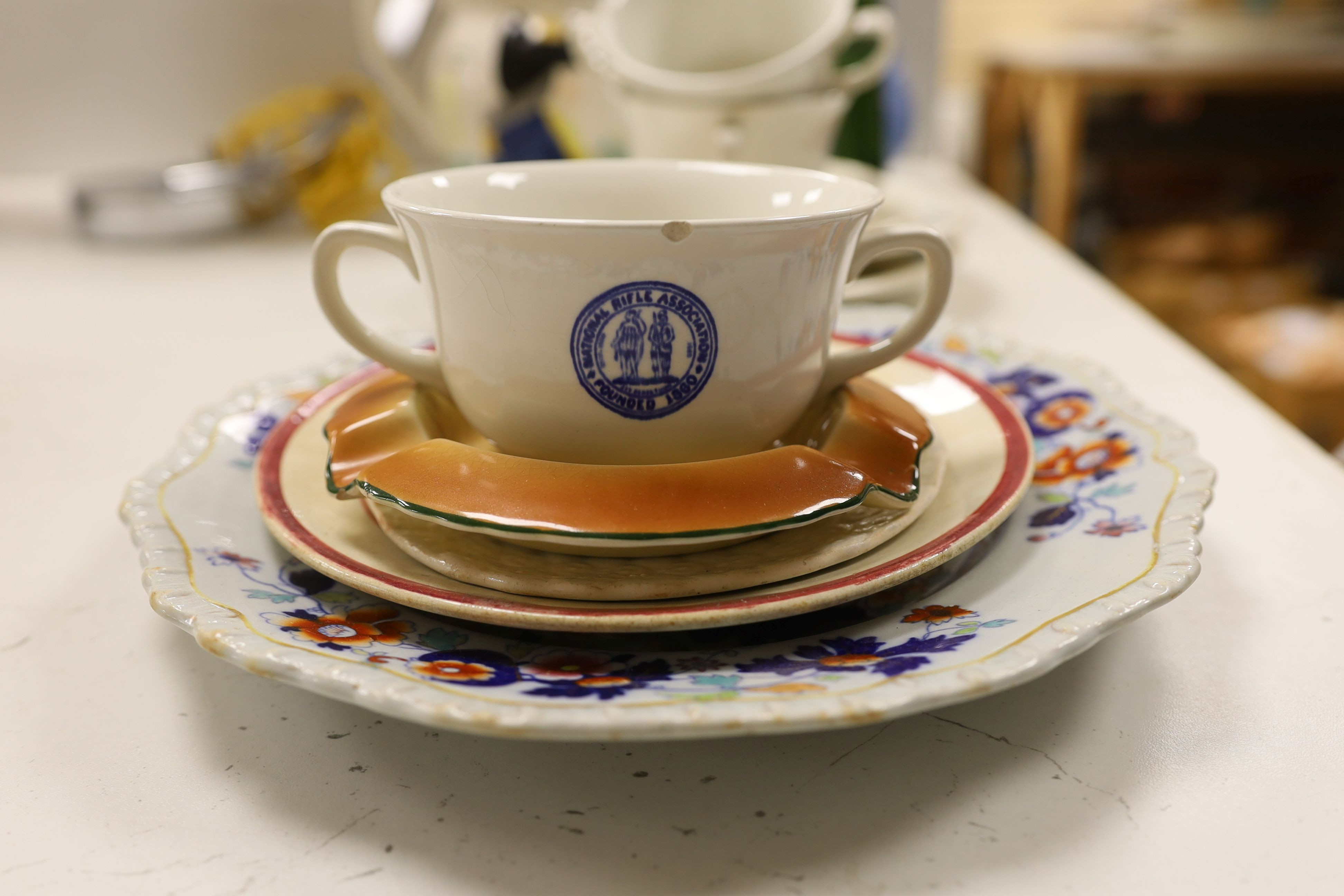 A collection of National Rifle Association ceramics.